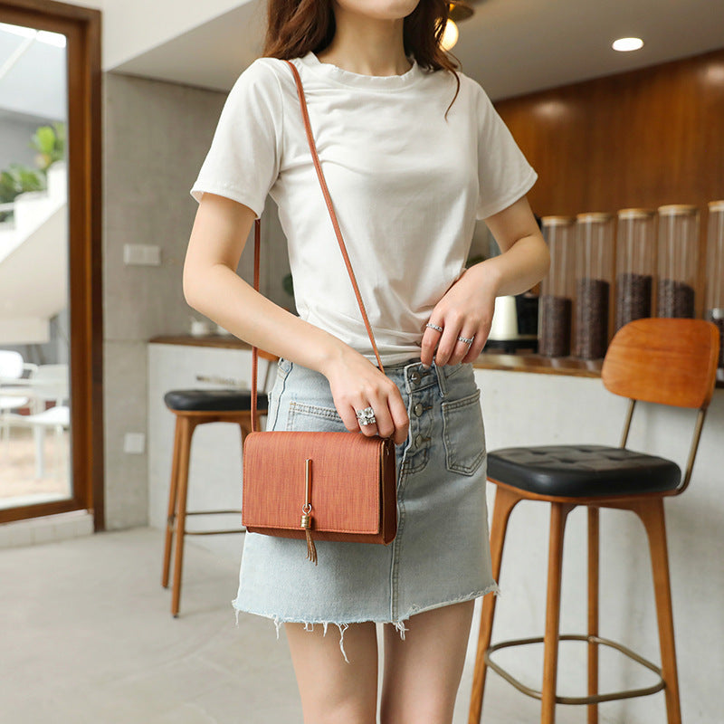 Women's bags 2020 summer new style Korean fashion messenger small bag tassel charm small square bag single shoulder handbag wholesale